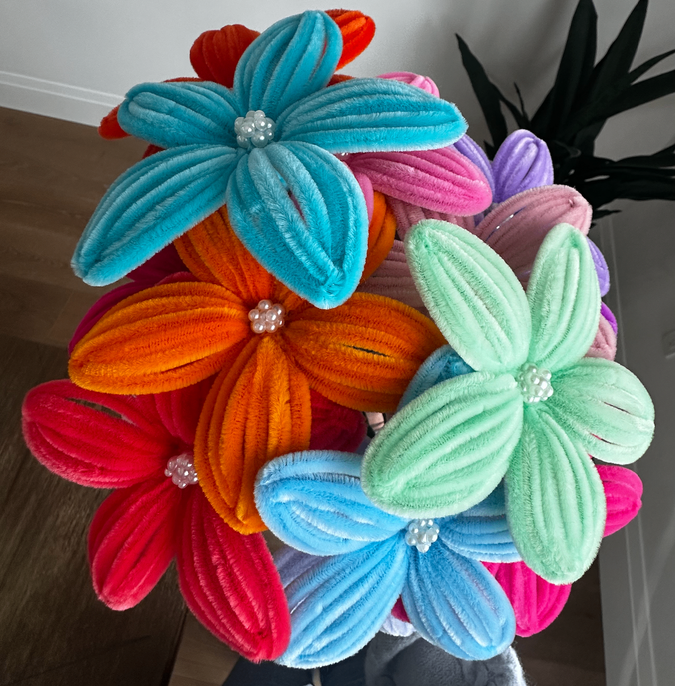 A vibrant handmade bouquet of pipe cleaner flowers